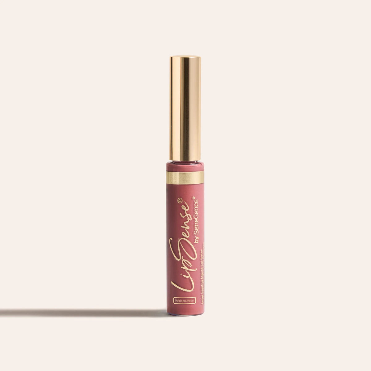 LipSense long lasting liquid lip color in a slim tube with a gold cap and rosy shade
