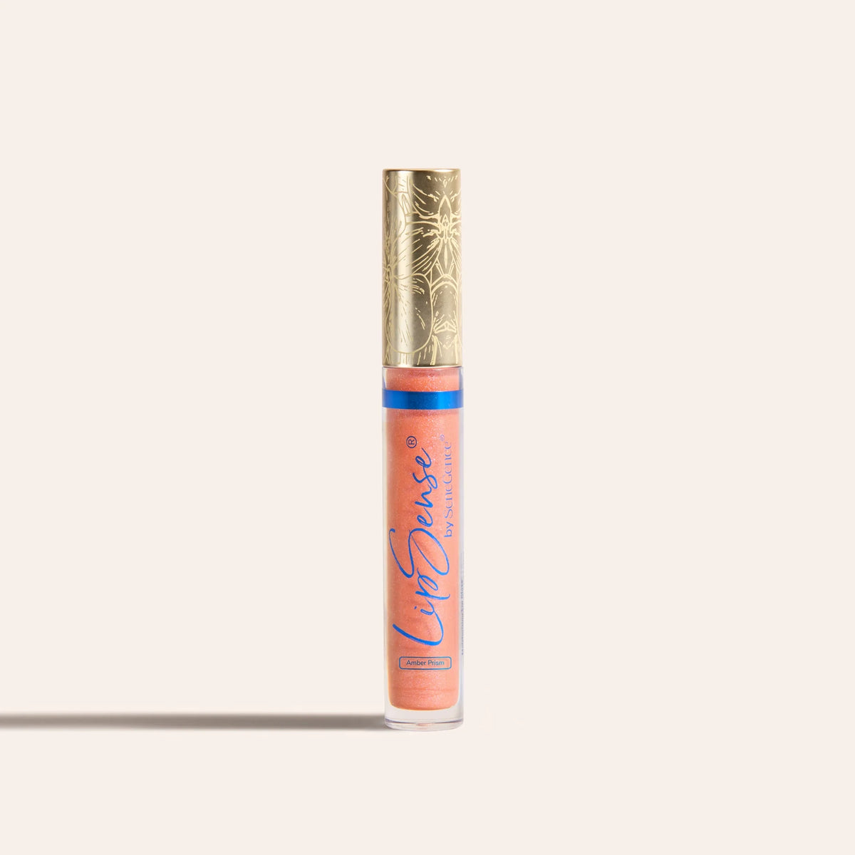 LipSense moisturizing gloss in a peach shade in a clear tube with a gold ornate cap.