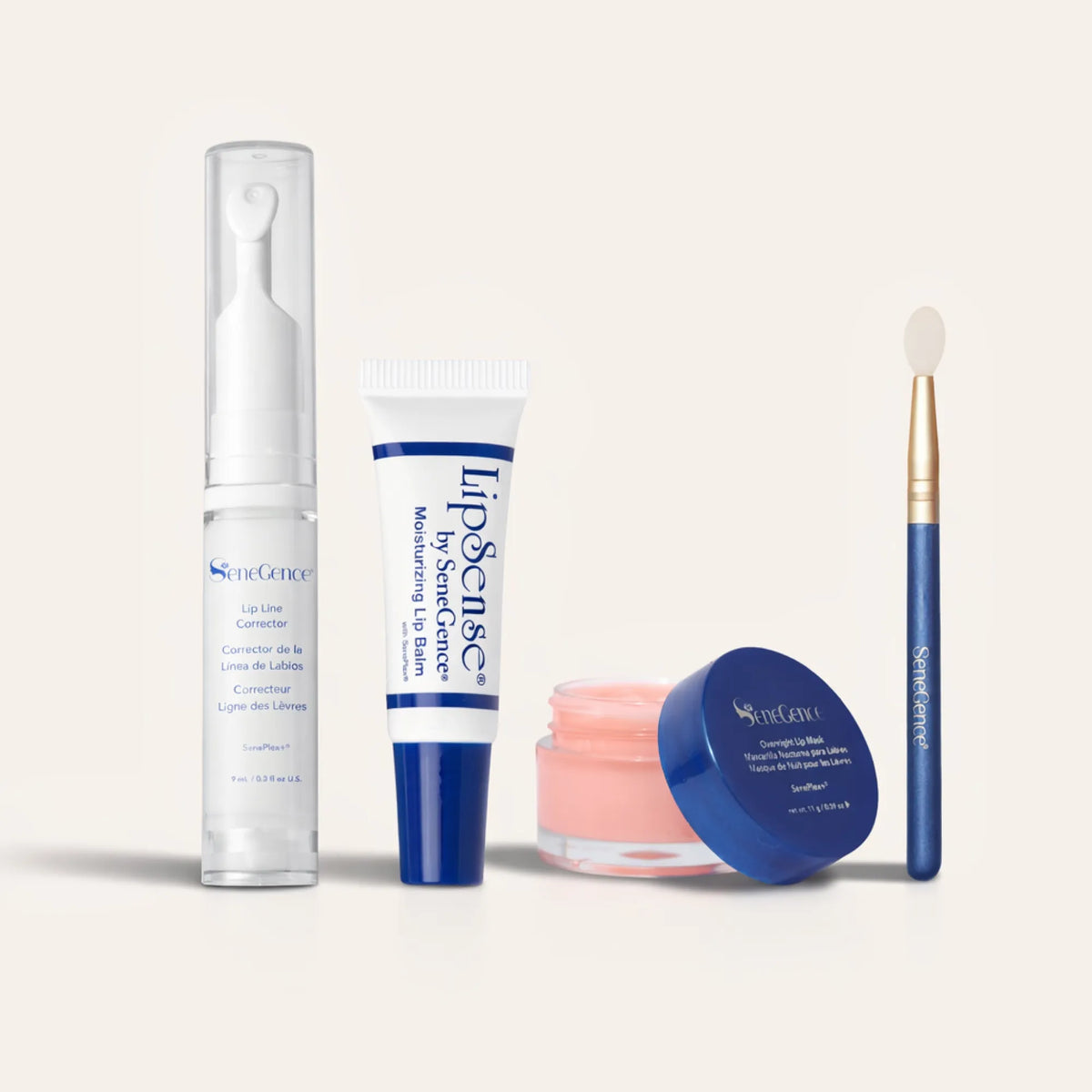 Ultimate Lip Care Collection NZL lineup with Lip Line Corrector in a tall clear pump, a white blue lip balm tube, a pink lip mask jar, and a blue handle applicator brush